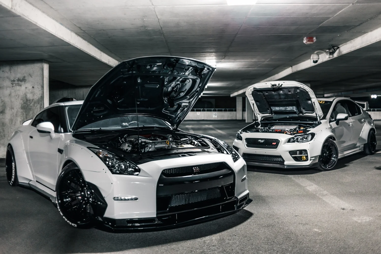 Two modified white sports cars