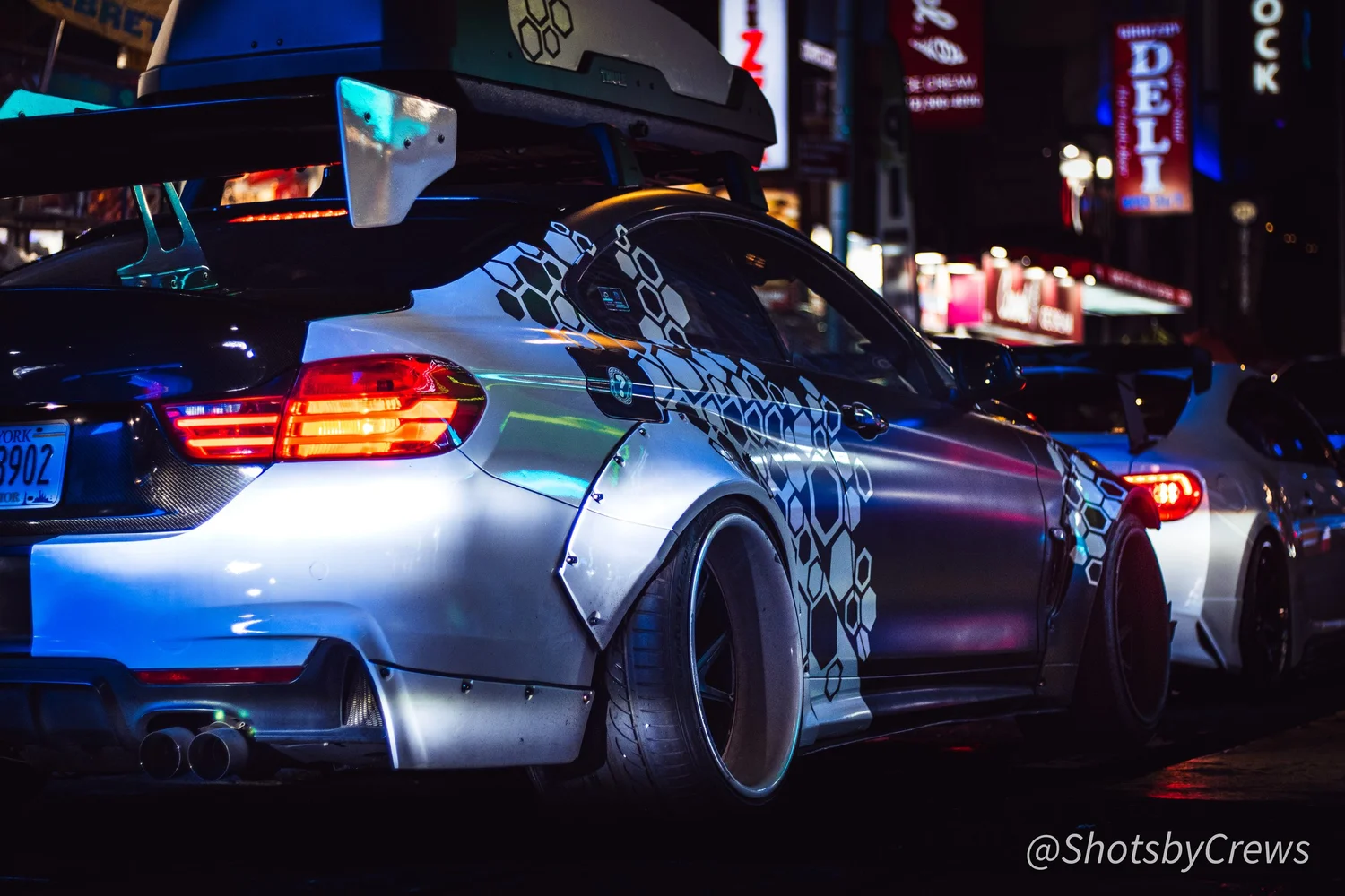 Modified widebody sports car photographed at night